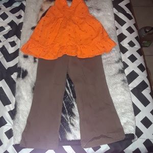 New top and brown pants